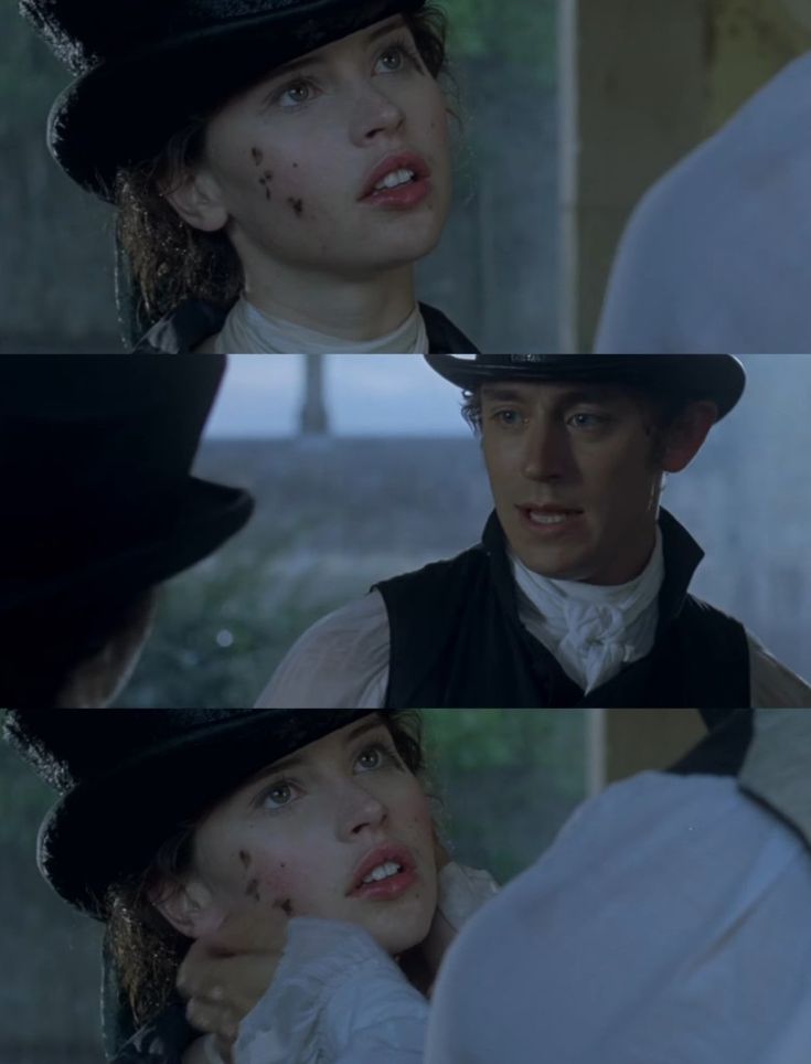 the actors are talking to each other while wearing top hats and vests with blood on their faces