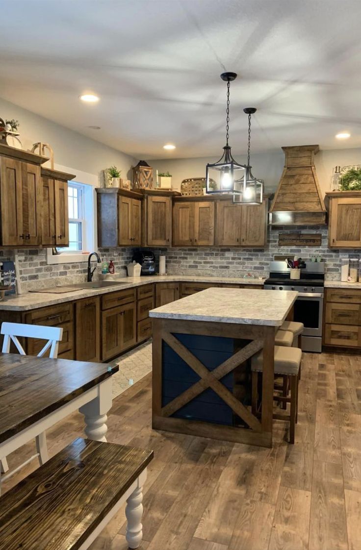 a large kitchen with wooden cabinets and an island