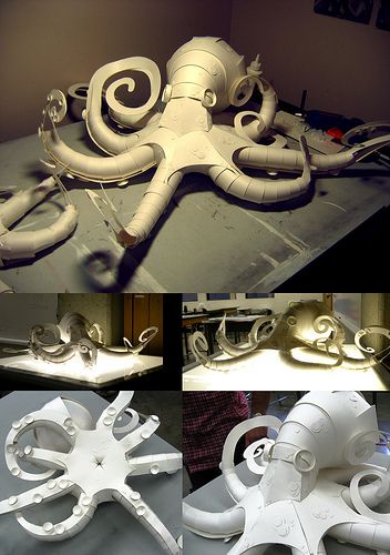 four different views of an octopus sculpture made out of paper machs and plywood