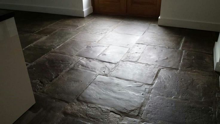 a kitchen floor that is made out of slate