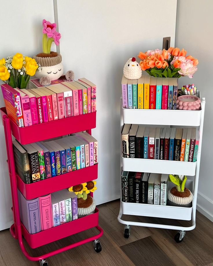 two bookshelves with flowers on each shelf in front of a white wall and wooden floor