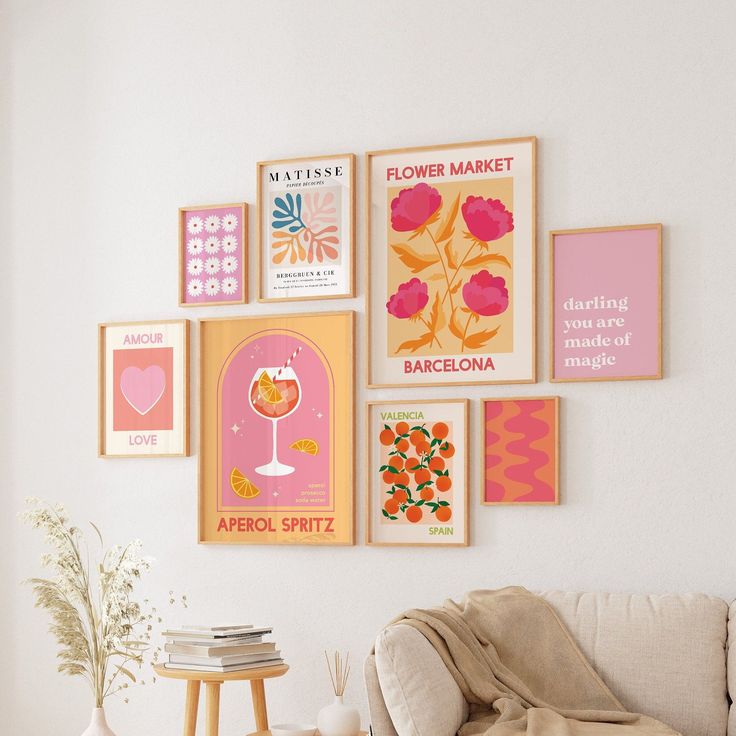 a living room filled with furniture and pictures on the wall