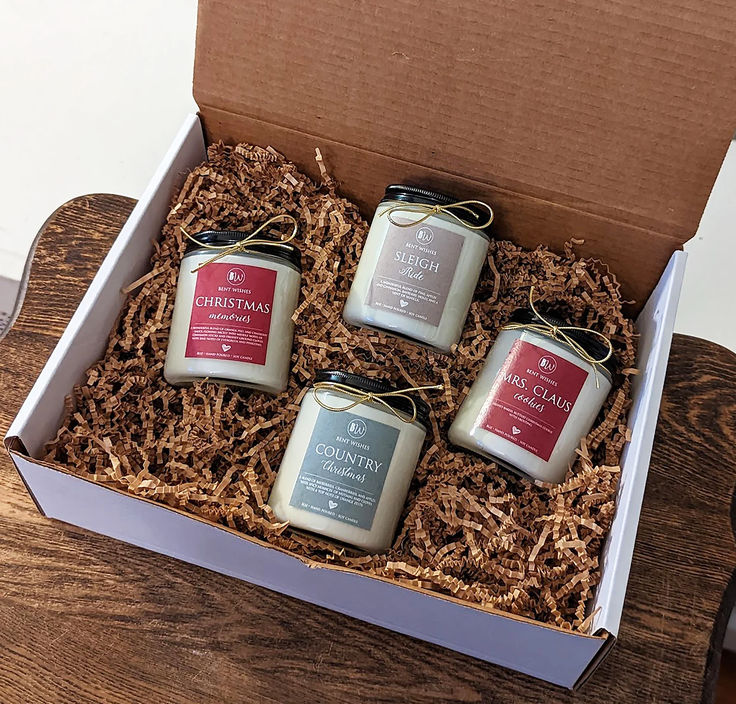 three candles in a box on a table