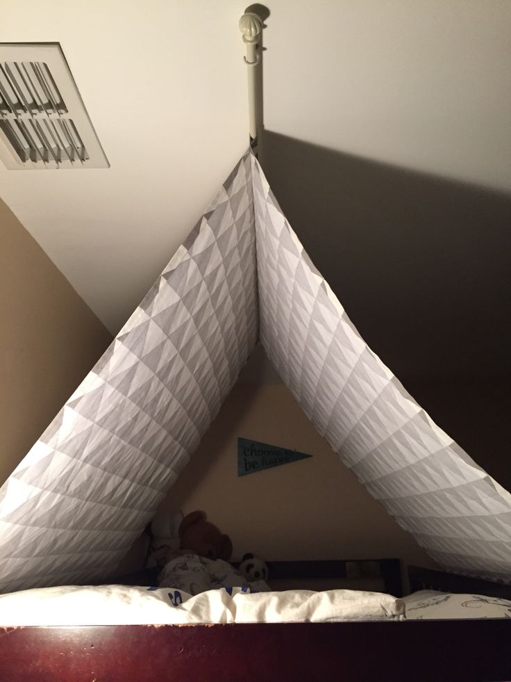 a child's bed with a canopy over it