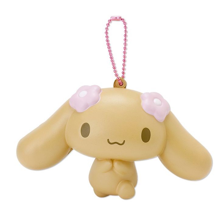 a small toy with a pink bow on it's head is hanging from a string