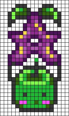 an image of a cross stitch pattern that looks like the face of a pumpkin with green eyes