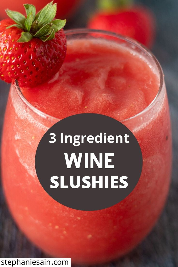 three ingredient wine slushies with strawberries in the background and text overlay that reads, 3 ingredient wine slushies