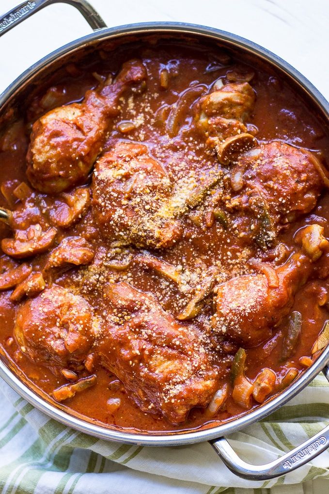 a pot filled with meat and sauce on top of a table