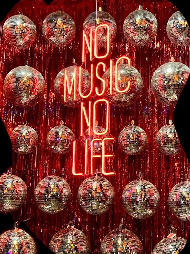 there are many shiny disco balls in front of the words no music, no life