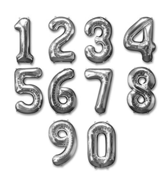 silver foil balloons in the shape of numbers on a white background with clippings