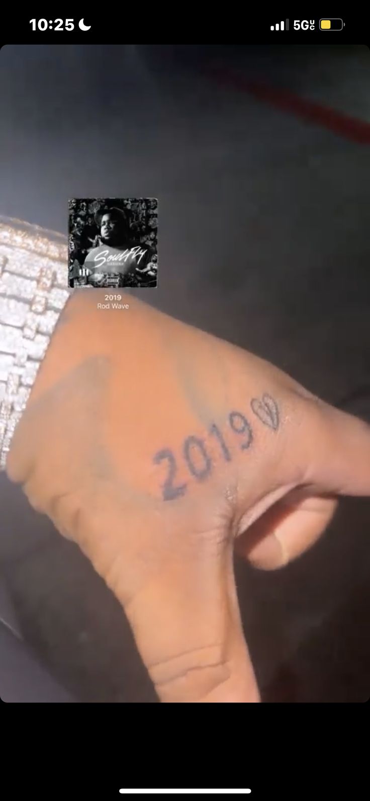 someone has written the date on their left hand