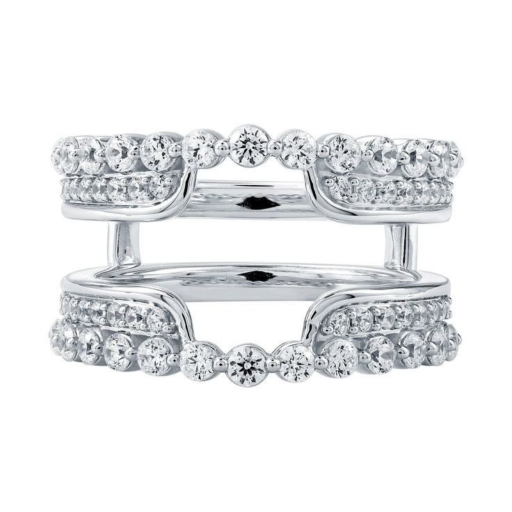 two white gold rings with diamonds on each one and the other in different sizes, set against