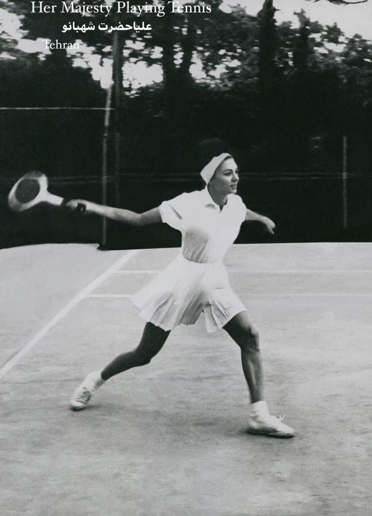 an old black and white photo of a woman playing tennis