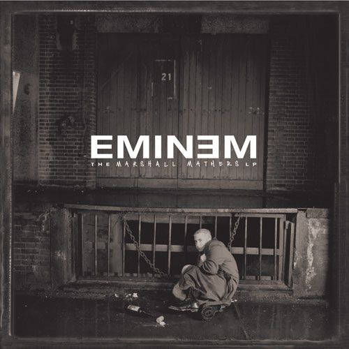 an album cover with a man sitting in front of a building and the words emiem on it