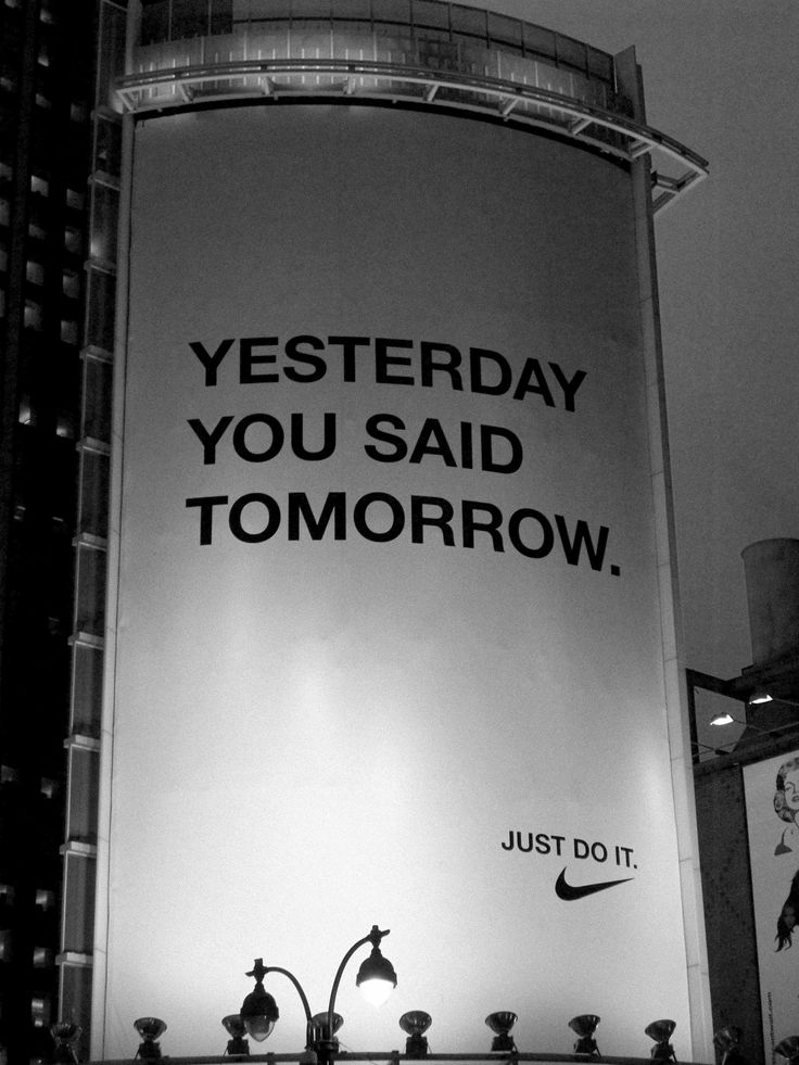 an advertisement on the side of a building that says, yesterday you said tomorrow just do it