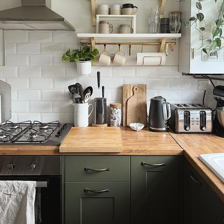 the kitchen counter is clean and ready to be used for cooking or baking, with utensils on it