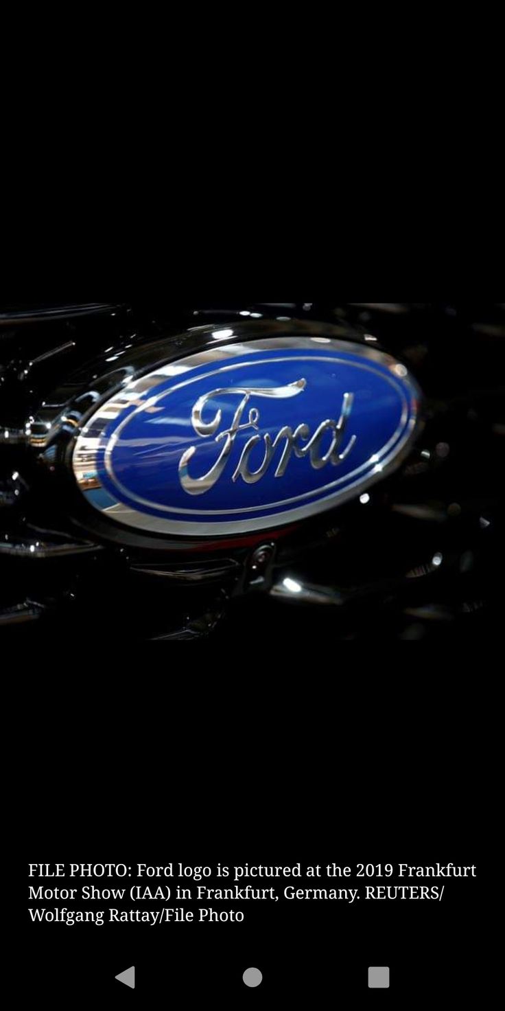 the ford logo is shown in this dark photo, and it appears to be on display