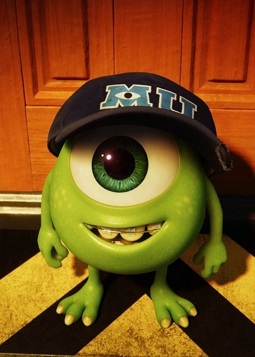 an image of a green monster with big eyes and a hat on it's head