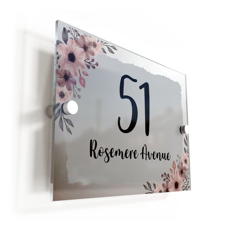 there is a sign with flowers on it that says, 51 rosemeau avenue