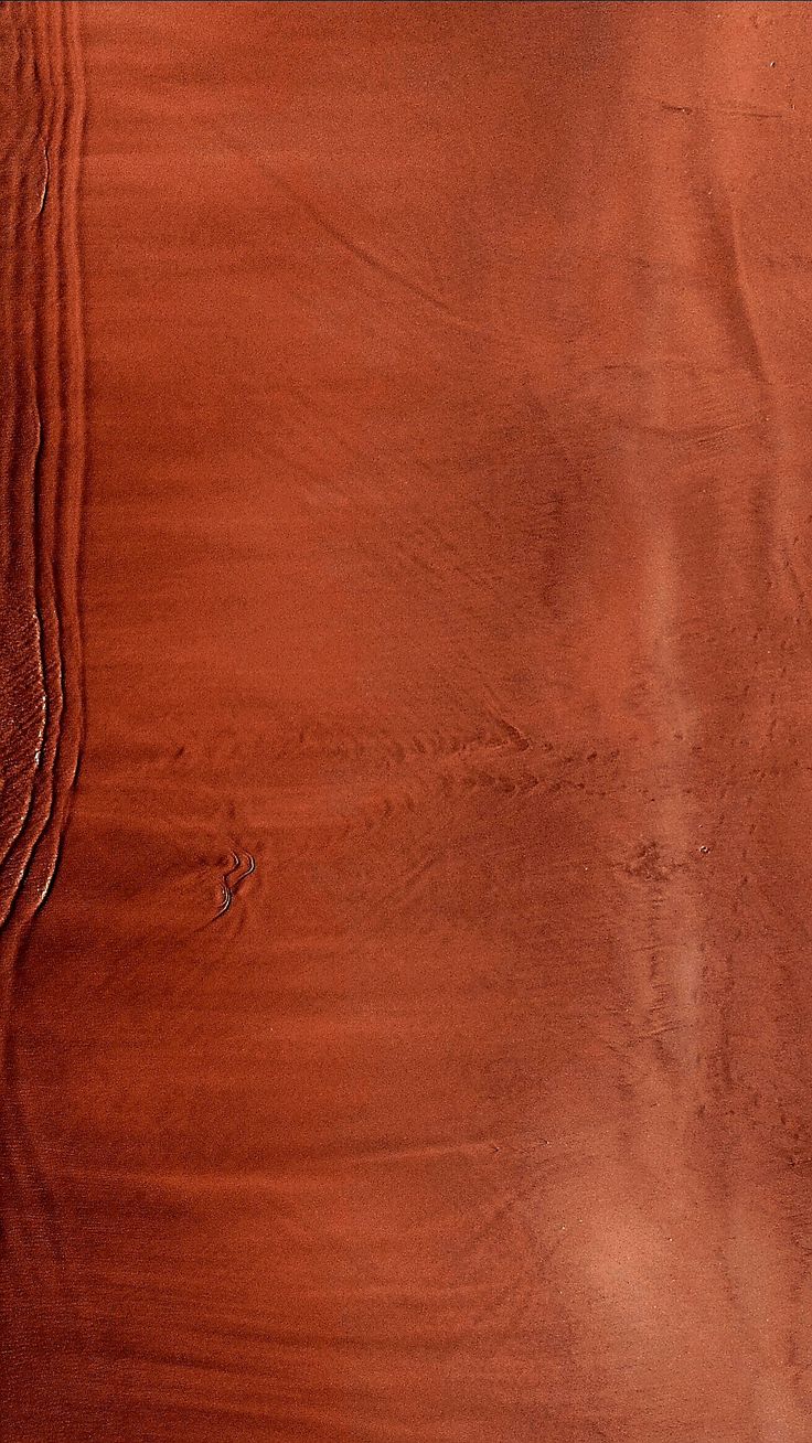 a close up view of the wood grains on a piece of furniture that has been stained red