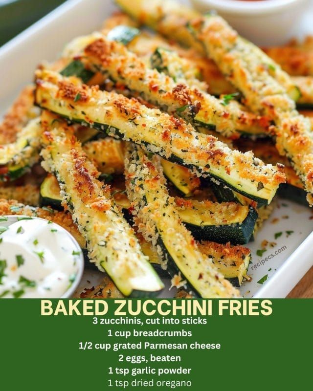 baked zucchini fries on a plate with dipping sauce