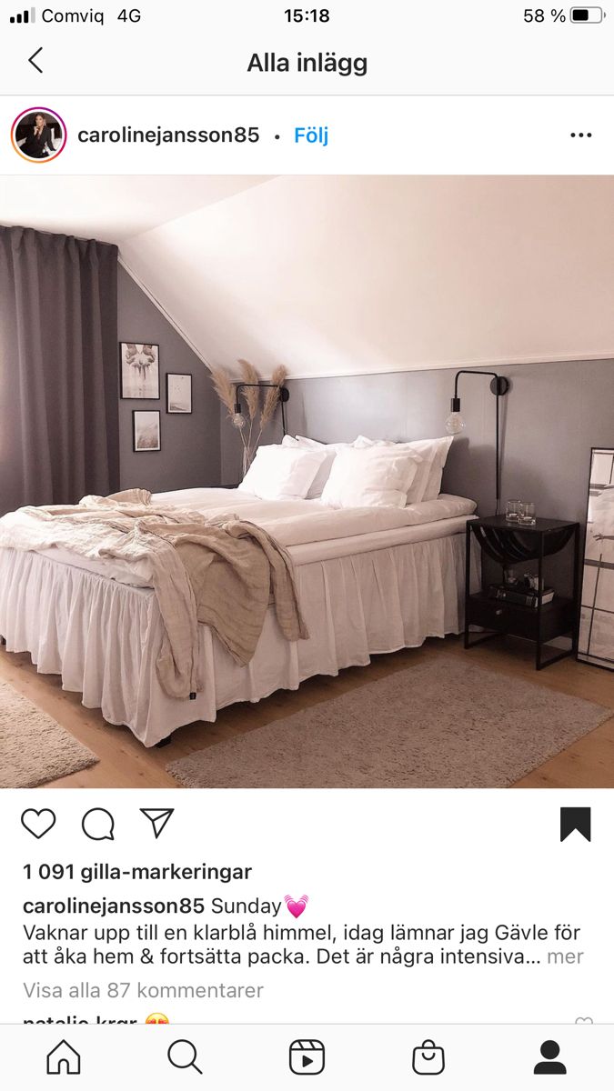 a bed sitting in the middle of a bedroom next to a window