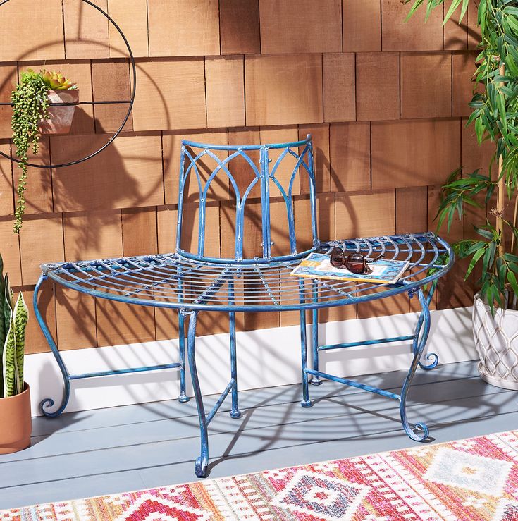 PRICES MAY VARY. Safavieh's collection of outdoor furniture brings resort-style relaxation to any home Made of sturdy iron with Victorian scroll details and an antique blue finish Full dimensions are 50" wide x 23.5" deep x 30.8" high Perfect for adding extra seating in the garden or backyard Safavieh has been a trusted brand in home furnishings for over 100 years, providing quality craftsmanship and unmatched style; Begin your rug and furniture search with Safavieh and explore over 100,000 prod Outdoor Tree Bench, Iron Outdoor Furniture, Wrought Iron Scrollwork, Tree Bench, Rod Iron, Outdoor Trees, Antique Blue, Patio Seating, Outdoor Living Areas