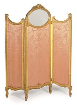 an ornately decorated room divider with mirror