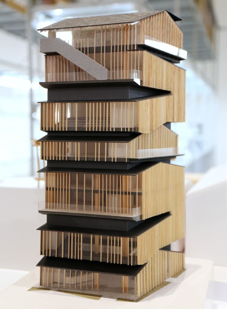 a model of a building made out of wooden slats and plexed wood