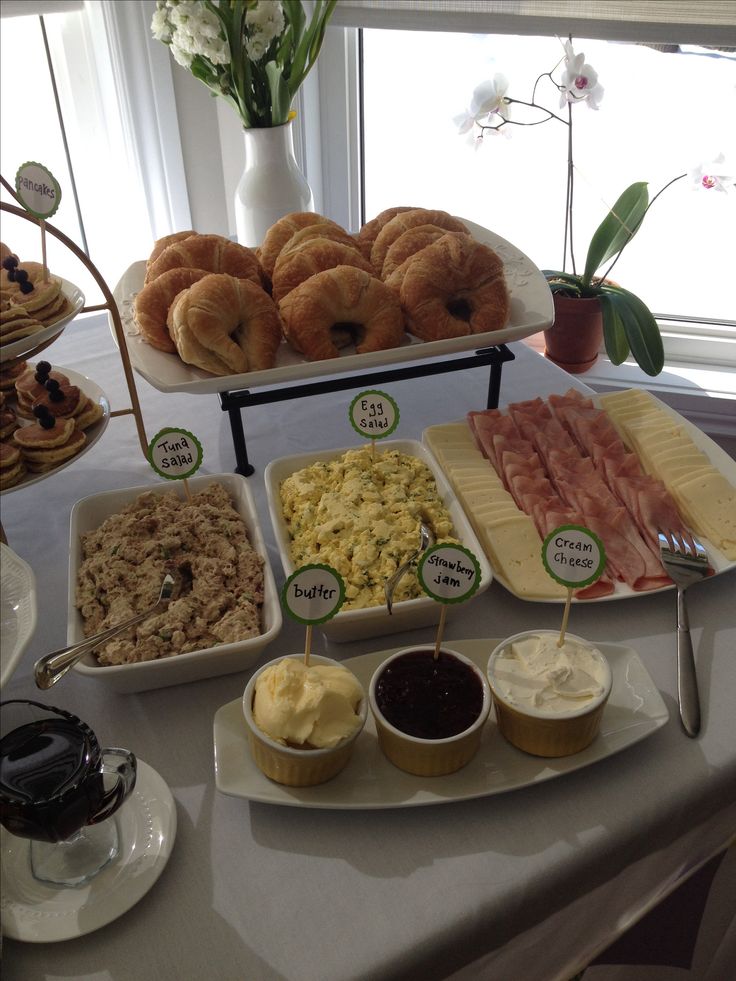 an assortment of breakfast foods displayed on a table