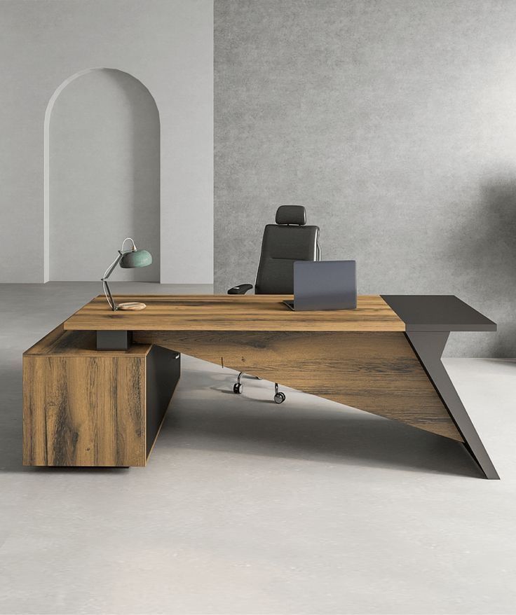 an office desk with a laptop on it