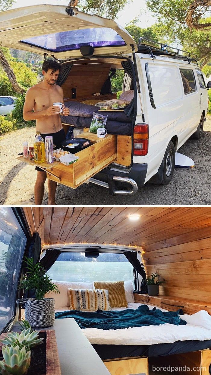 a man standing in the back of a van next to a bed