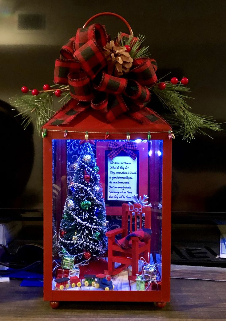 a christmas display case with a tree in it