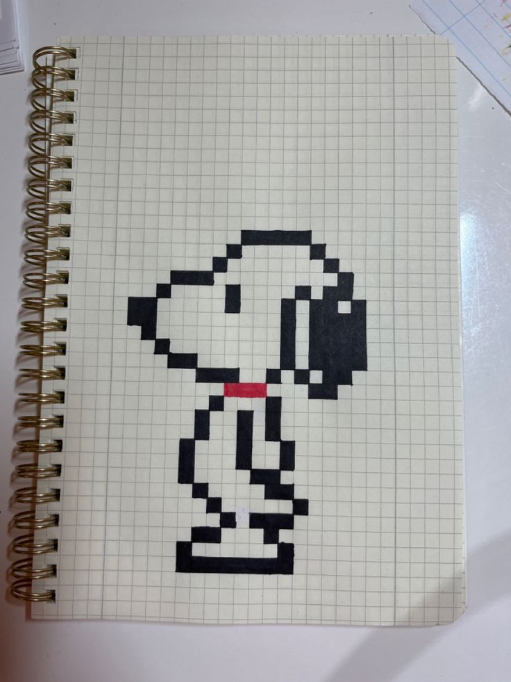 a notebook with a drawing of a dog on it