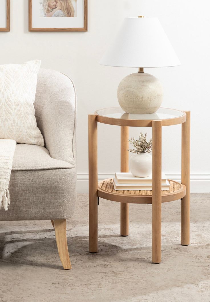 a living room scene with focus on the end table and chair next to the couch