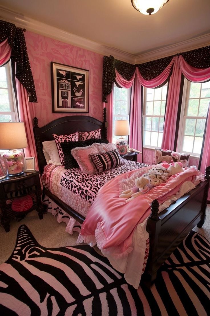 a bedroom decorated in pink, black and white with zebra print on the bedding