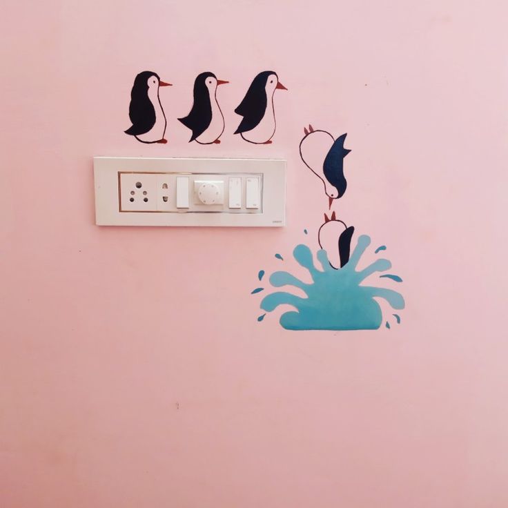 three birds are standing on top of an electrical outlet