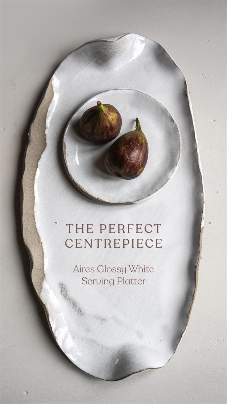 two figs on a plate with the words the perfect centerpiece