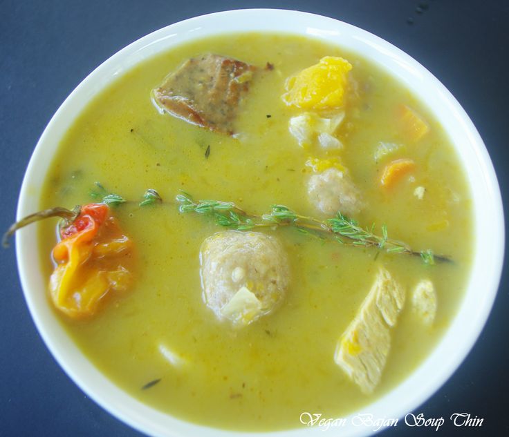 a white bowl filled with soup on top of a table