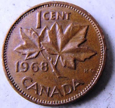 an old canadian coin with the maple leaf on it