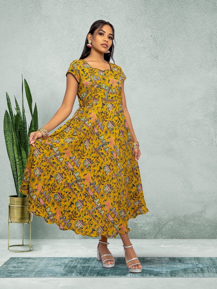 Embrace elegance with our Tranquil Threads yellow knee-length dress. Featuring a stunning print, this dress is perfect for everyday wear or a night out in the city. Crafted with care for the modern woman who values both comfort and style. Key Specifications : Material Kalankari Silk Occasion Casual Type Fusion/Indowestern Knee-length Printed Sundress, Printed Knee-length Sundress, Yellow Bohemian Knee-length Midi Dress, Spring Beach Dress With Kalamkari Print, Yellow Floral Print Knee-length Dress, Bohemian Yellow A-line Dress, Elegant Yellow Printed Dress, Casual Yellow A-line Dress, Printed Yellow Maxi Dress