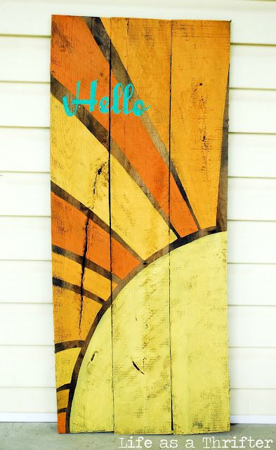 a surfboard painted on the side of a building