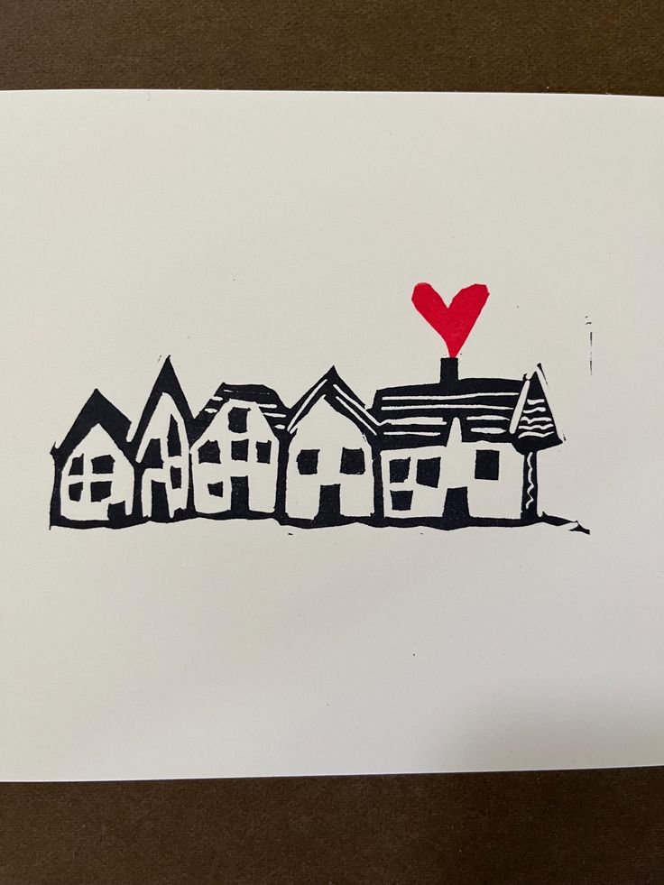 a drawing of houses with a red heart on top