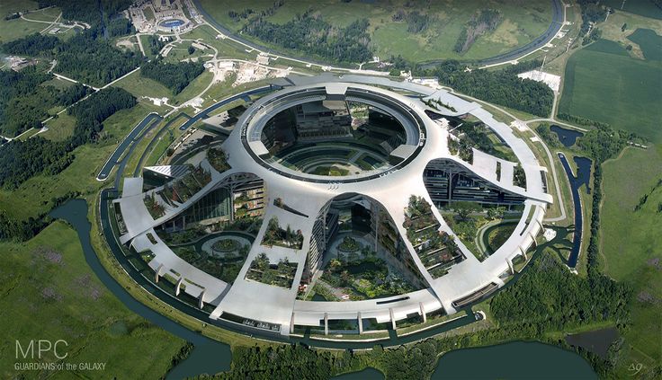 an aerial view of a circular building surrounded by trees