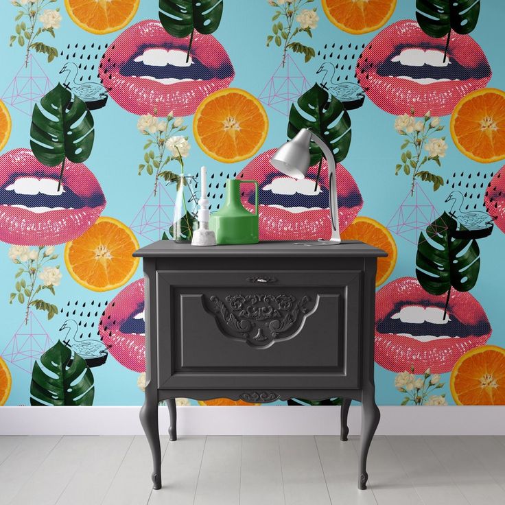 an image of a wallpaper with lips and flowers on the side table in front of it