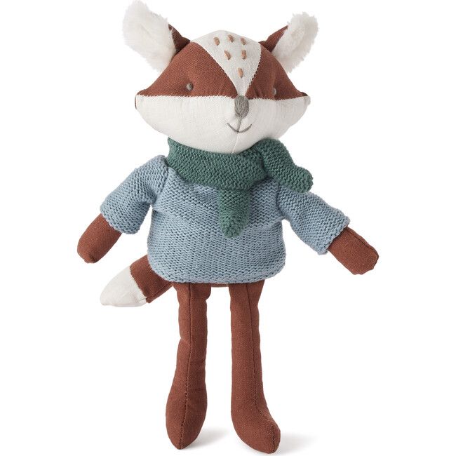 a stuffed animal wearing a sweater and scarf