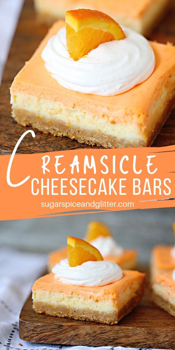 orange cheesecake bars with whipped cream on top and an orange slice in the middle