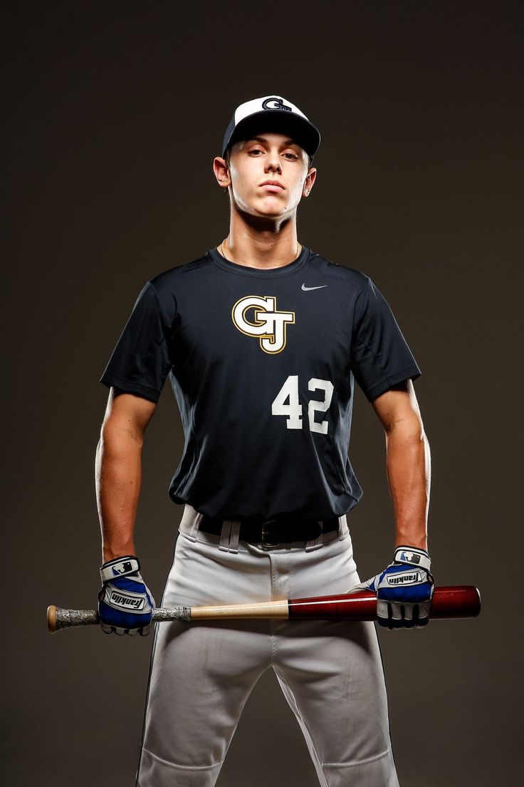 a baseball player poses with his bat and helmet in this studio photo taken on oct 11, 2012