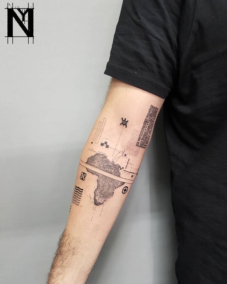 a man with a tattoo on his arm that has an image of the earth in space