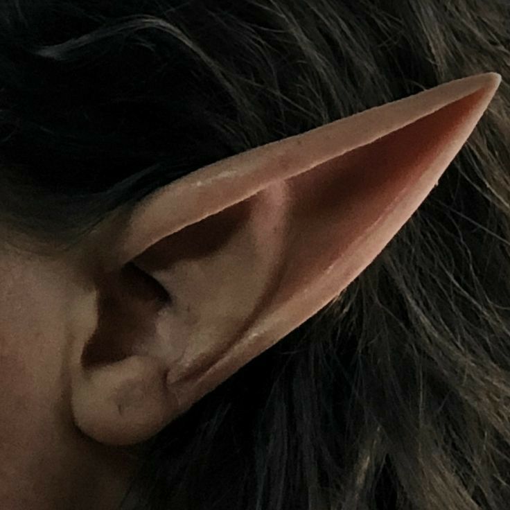 a close up of a person's ear with an odd shaped object on it